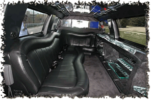 The inside of a 14 passenger Lincoln Navigator SUV in a black colour