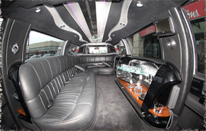 The inside of a 14 passenger Lincoln Navigator SUV in a white colour